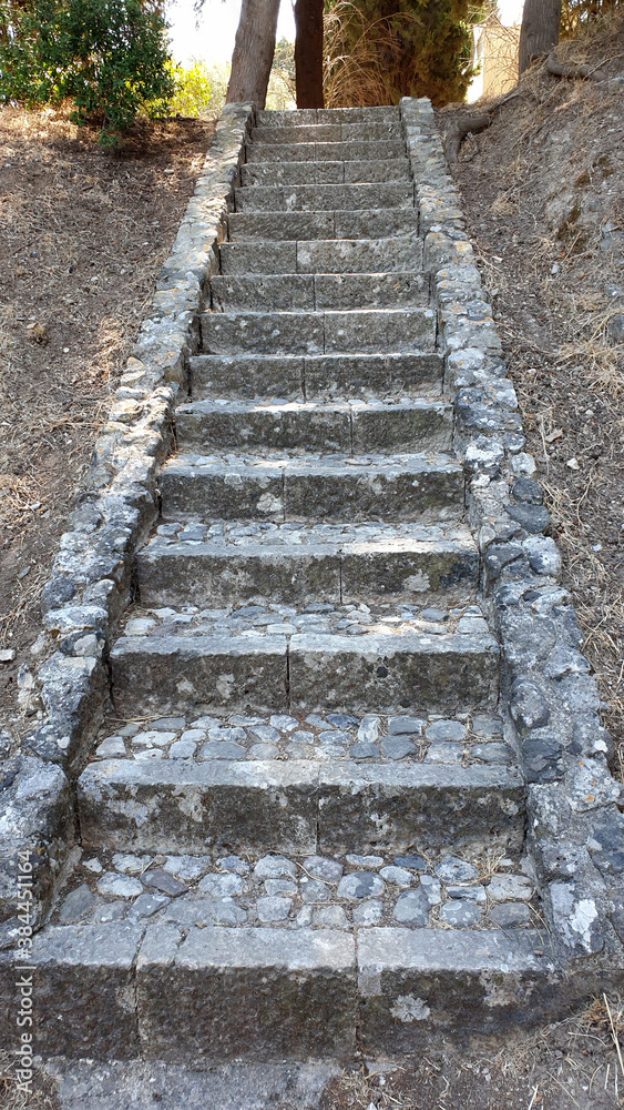 A long ancient stairs from briks and stones. Greece A long ancient stairs from briks and stones. Greece