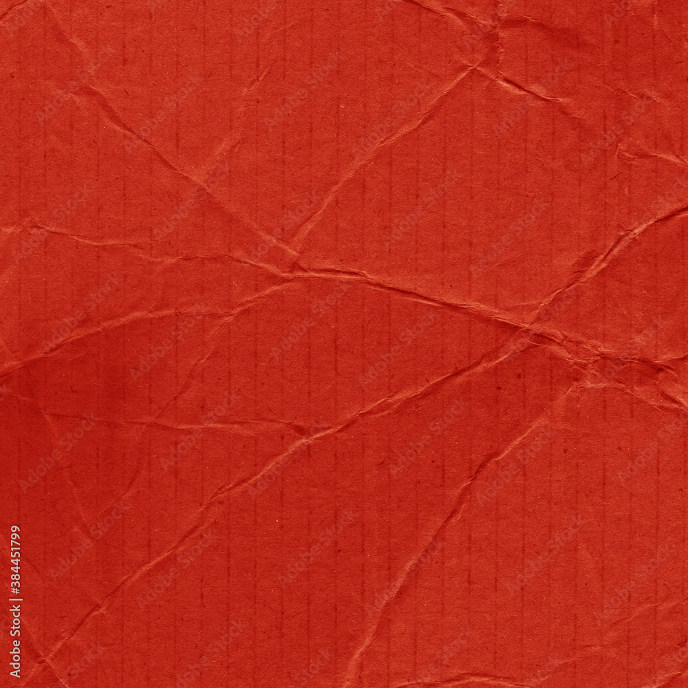 Obraz premium A red vintage rough sheet of carton. Recycled environmentally friendly cardboard paper texture. Simple and bright minimalist papercraft background.