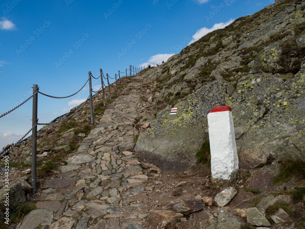 Trail to the top of Sniezka mountain. Border post next to the trail. Trail to the top of Sniezka mountain. Border post next to the trail.