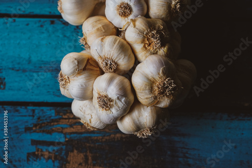 garlic bunch on a blue wooden table