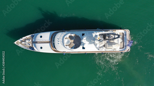 Aerial drone photo of luxury yacht cruising to Athens Marina and port in Piraeus, Attica, Greece