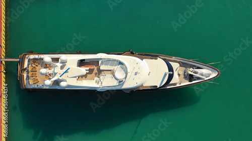 Aerial drone top down photo of luxury yachts anchored in Mediterranean port