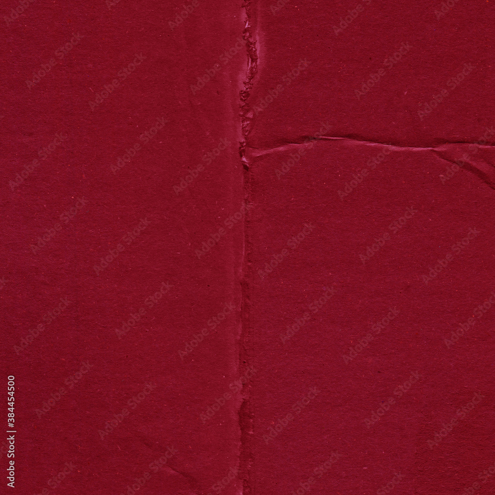 Fototapeta premium Red vintage rough sheet of carton. Recycled environmentally friendly cardboard paper texture. Simple and bright minimalist papercraft background.