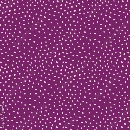 Doodle seamless pattern of hand drawn dot textured purple background