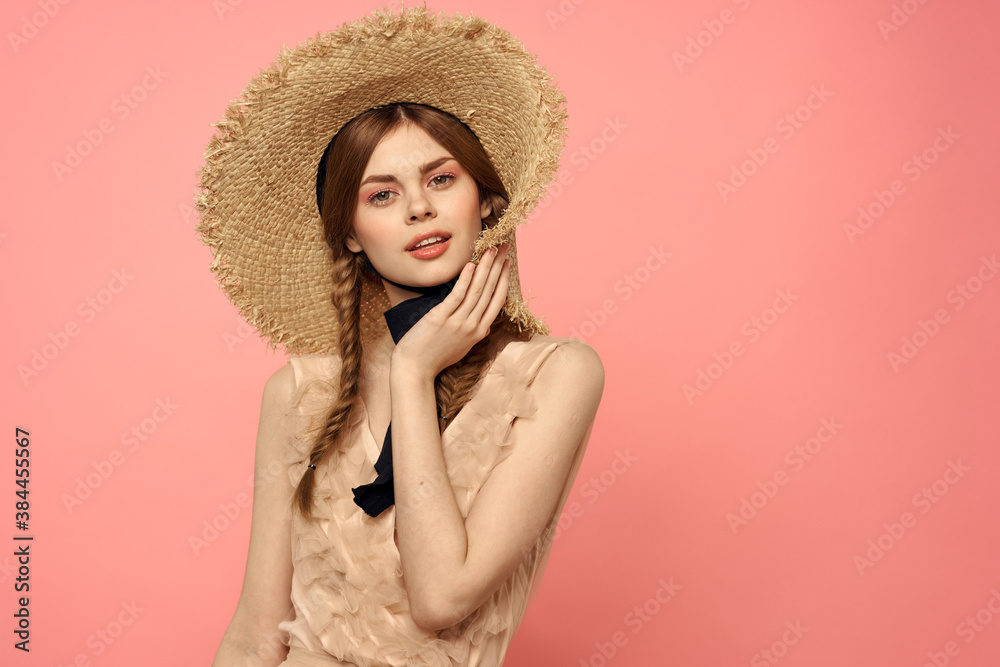 Beautiful woman in hat and in black dress ribbon portrait pink background model Beautiful woman in hat and in black dress ribbon portrait pink background model