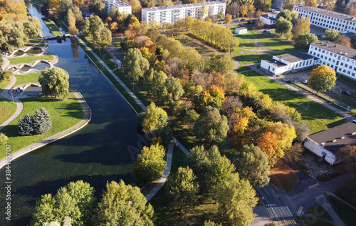 Top view of a beautiful green park with a river