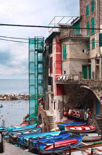 Obraz na płótnie Fishing boats on the pier in Riomaggiore Village w salonie