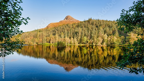 Known in Gaelic as Sgorr na Ciche, the Pap of Glencoe is a familiar landmark around the lower end of the glen and Loch Leven. Seen here with beautiful reflections in the water