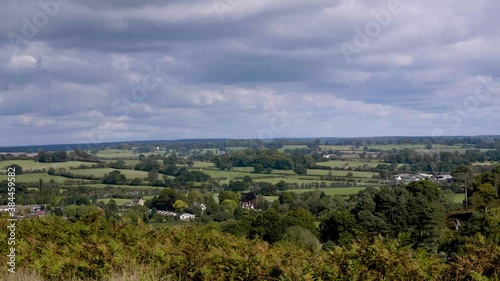 storm clouds looming over distant housing