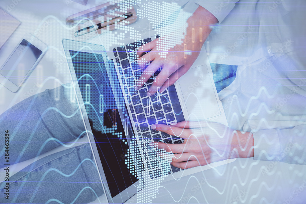 Double exposure of woman hands working on computer and forex graph hologram drawing. Top View. Financial analysis concept. Double exposure of woman hands working on computer and forex graph hologram drawing. Top View. Financial analysis concept.
