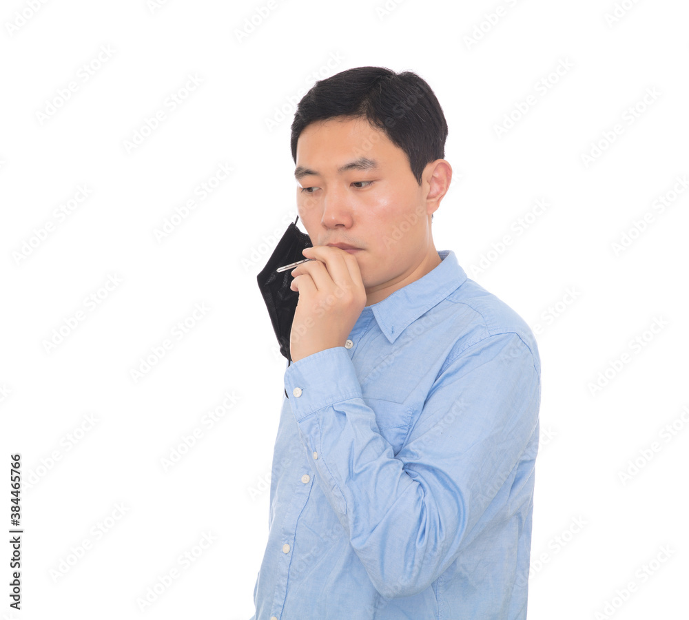 The man is taking his temperature through his mouth The man is taking his temperature through his mouth