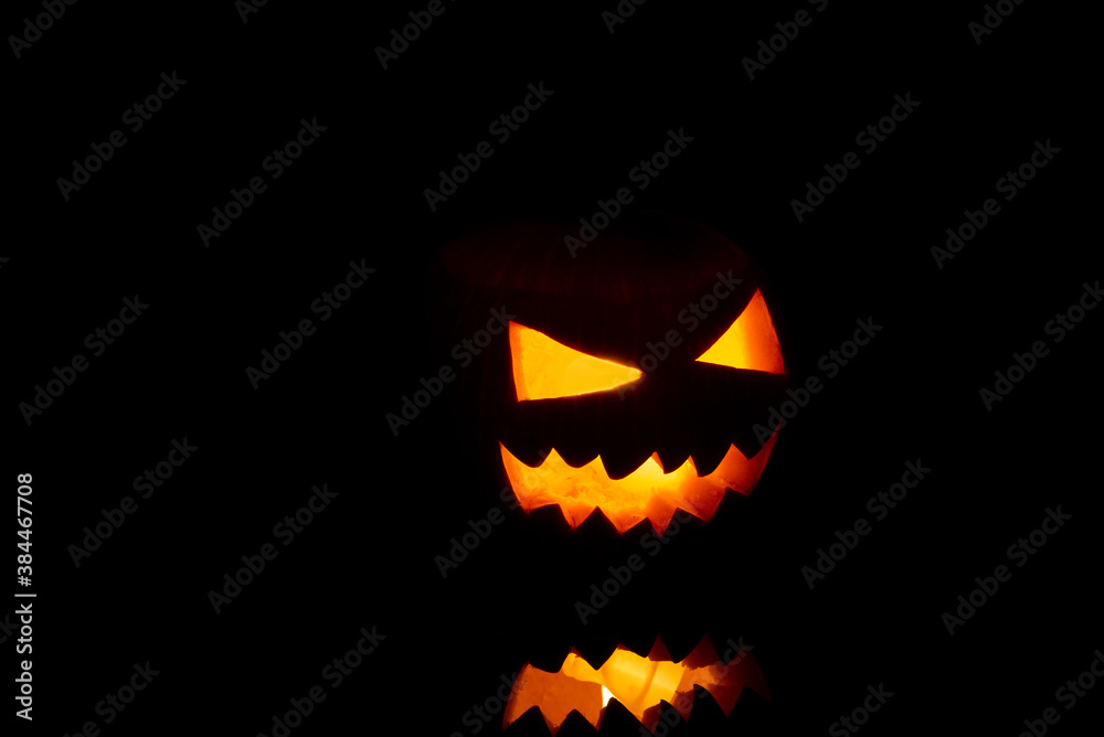 Fototapeta premium Jack o Lantern on a black background.