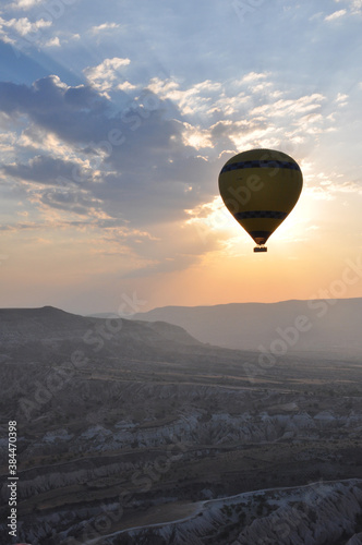 Vertical shot of hot air balloon silhouettes at sunrise over Cappadocia, Turkey