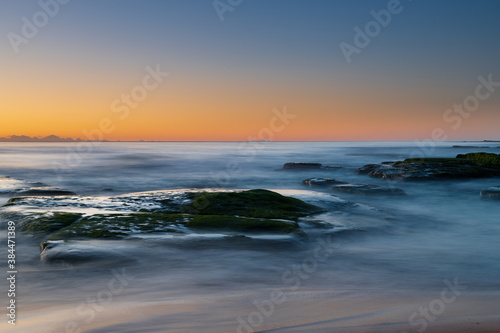Clear skies and soft seas, dawn at the beach