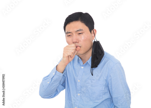 Man taking off his mask and coughing in front of white background