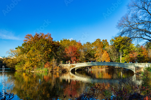 Central Park bridge reflection during fall © Thomas