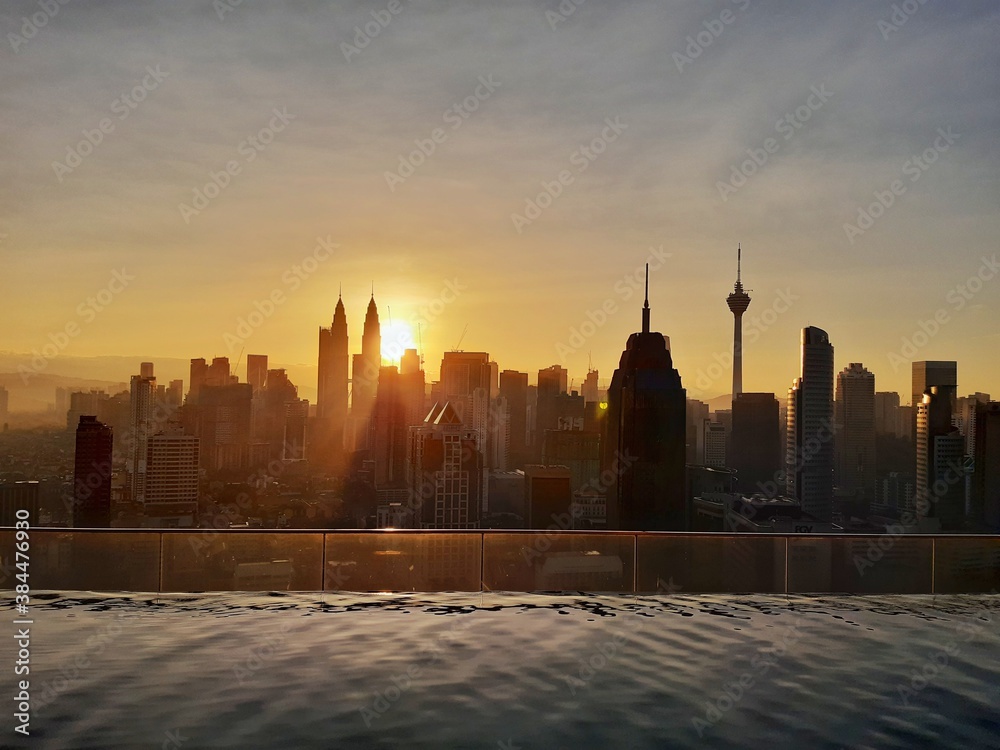 Obraz premium Malaysia, perfect view to a capital city. Kuala Lumpur is a powerhouse financial and business hub in South East Asia. The most famous are Petronas Twin Towers (the world's tallest twin skyscrapers). 