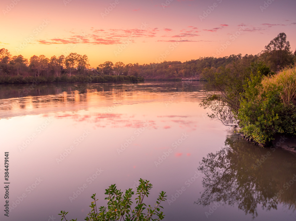 Fototapeta premium Beautiful Riverside Sunrise with Cloud Reflections