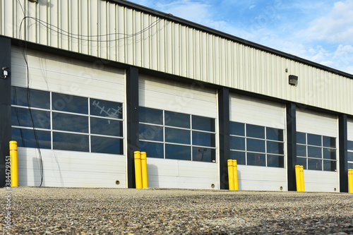An image of a closed overhead door on an industrial building.  photo