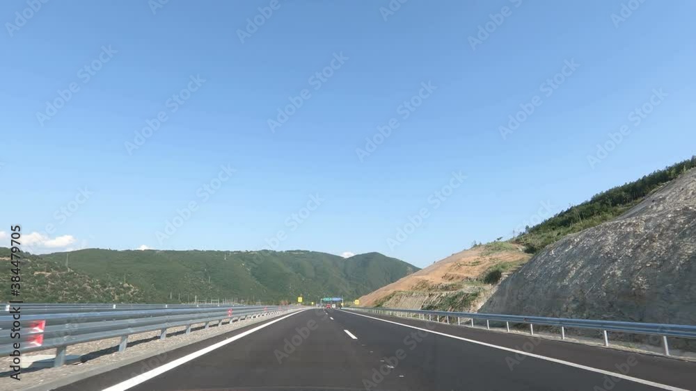 Timelapse lapse speed POV vehicle drive, one way highway asphalt road against blue sky, car travel gopro point of view, sunny day