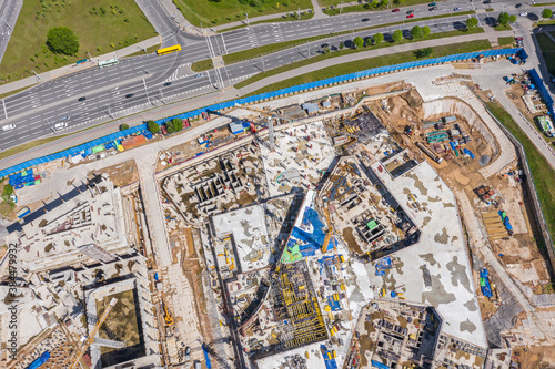aerial image of a large commercial building during early stage of construction. modern buildings under construction