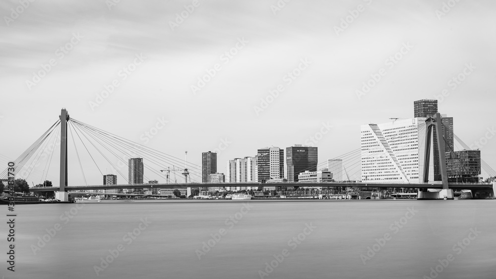 Bridge over the Meuse in Rotterdam surrounded by buildings - Rotterdam - Netherlands - July 2019