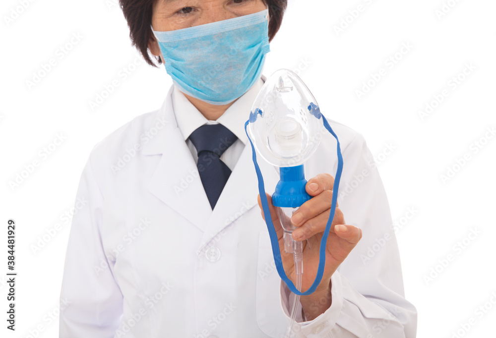 A respiratory doctor in a white coat is holding a nebulization tool in hand A respiratory doctor in a white coat is holding a nebulization tool in hand