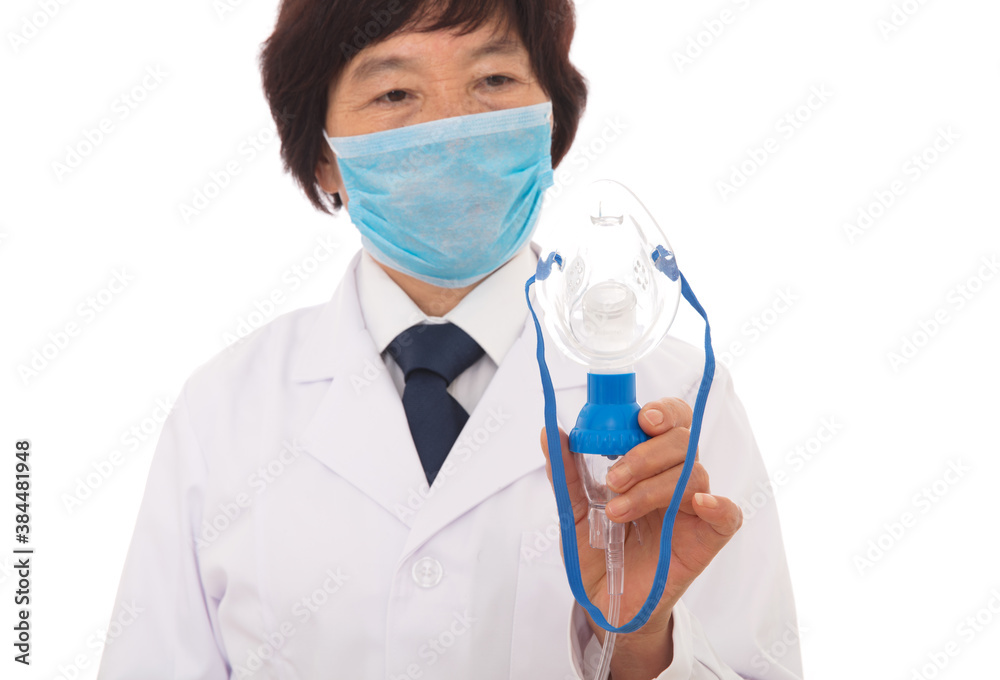 A respiratory doctor in a white coat is holding a nebulization tool in hand A respiratory doctor in a white coat is holding a nebulization tool in hand