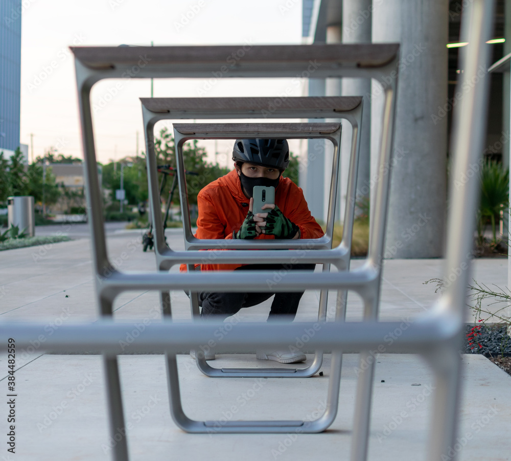boy wearing black helmet black face mask takes a photo boy wearing black helmet black face mask takes a photo