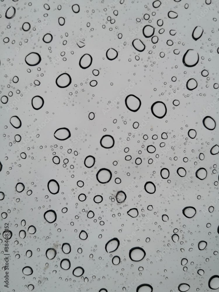 Abstract rain drops on clear stained glass. Abstract rain drops on clear stained glass.