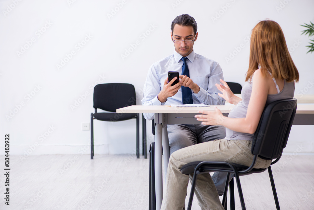 Pregnant woman visiting male psychologist doctor Pregnant woman visiting male psychologist doctor