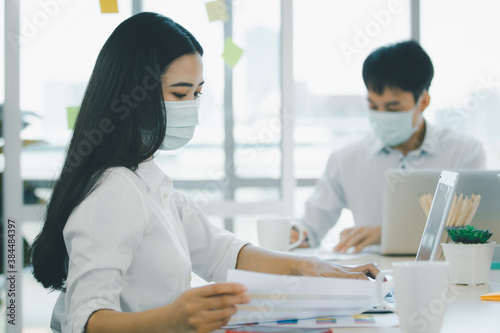 Group of senior businesspeople with hygiene protective face mask in meeting