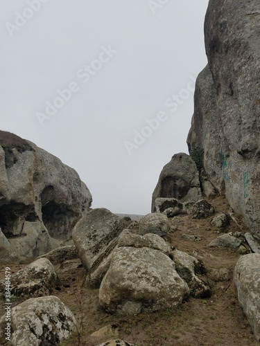Rock formation in a misty foggy background