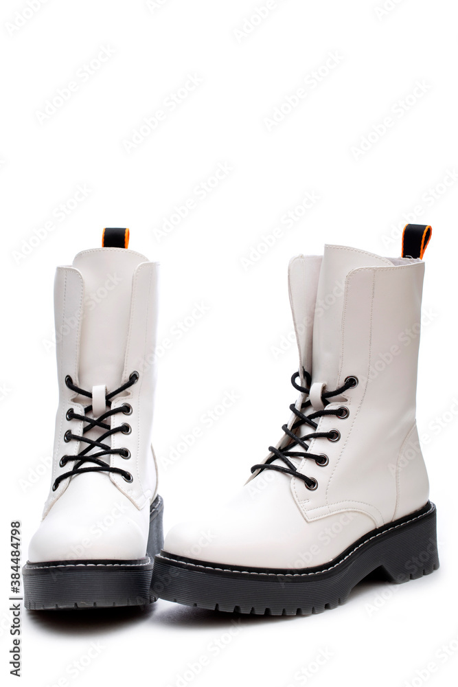 Women's white boots with thick soles on a white background