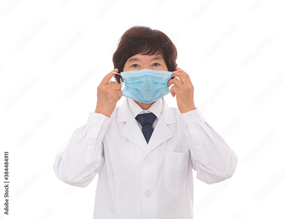 Female doctor demonstrating the correct wearing of a mask Female doctor demonstrating the correct wearing of a mask