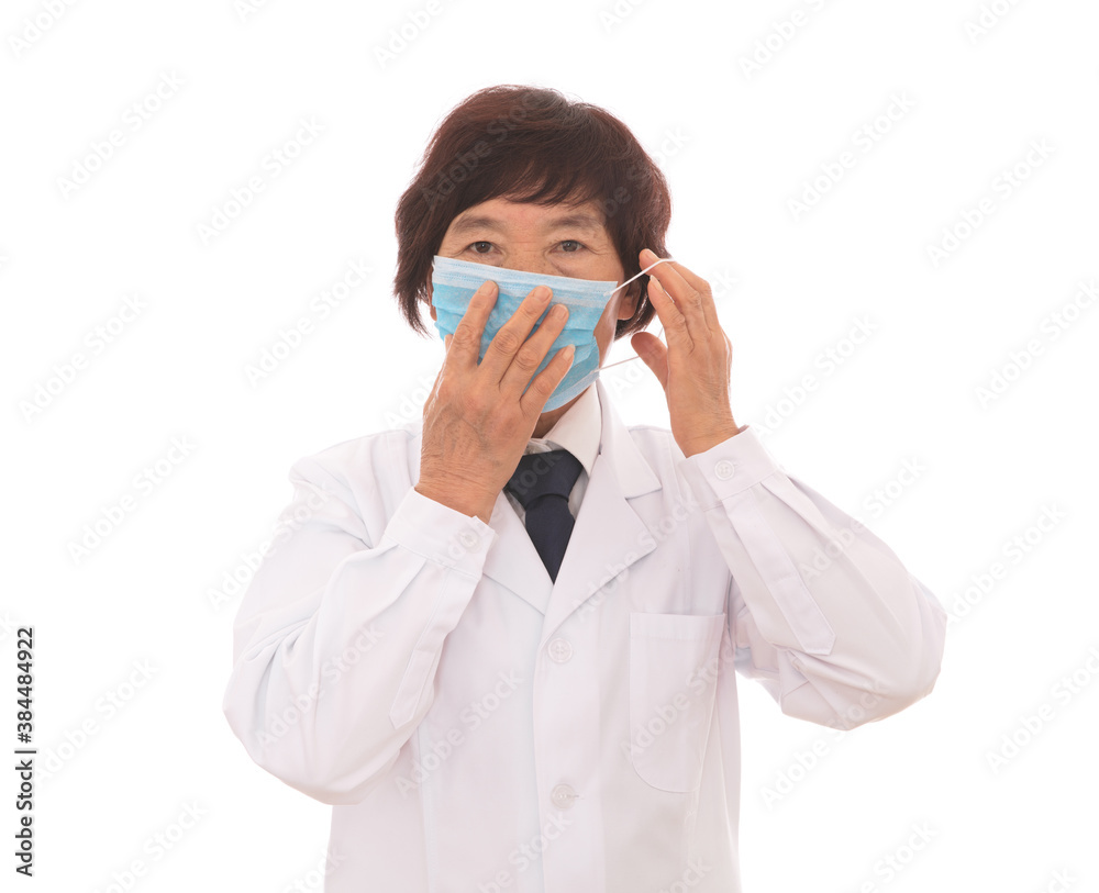 Female doctor demonstrating the correct wearing of a mask Female doctor demonstrating the correct wearing of a mask