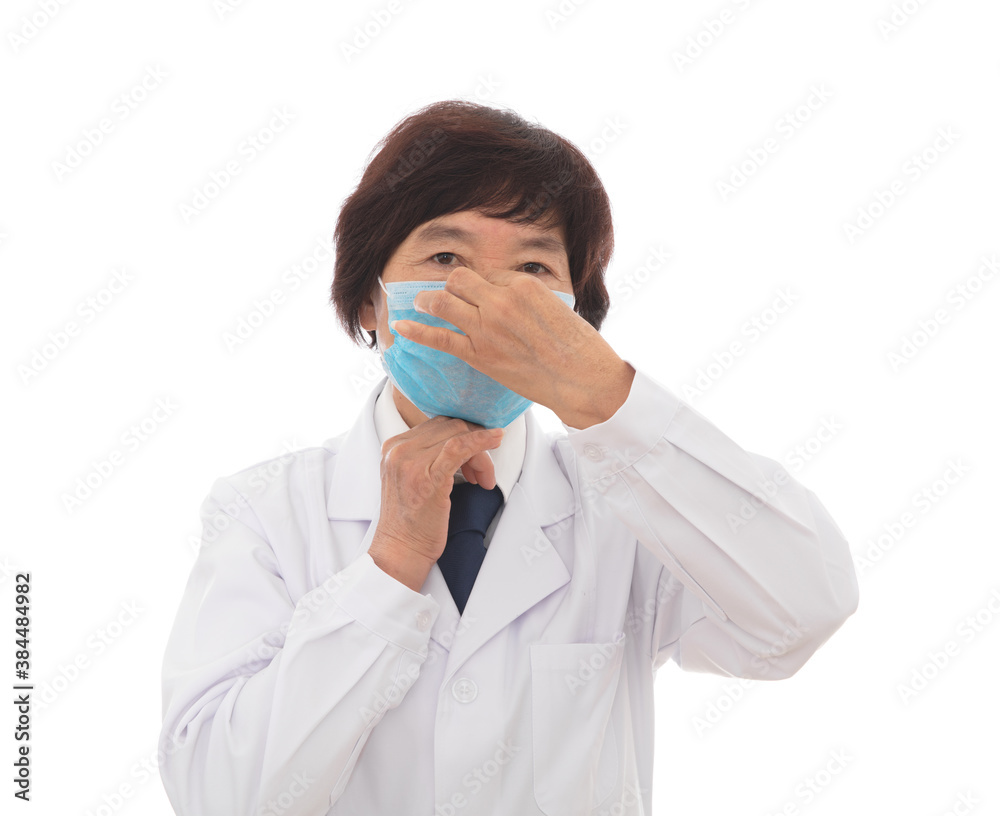 Female doctor demonstrating the correct wearing of a mask Female doctor demonstrating the correct wearing of a mask