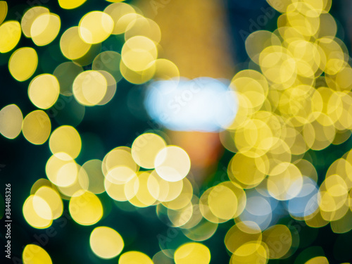 Abstract blur of night bokeh light on Christmas tree © TongTa
