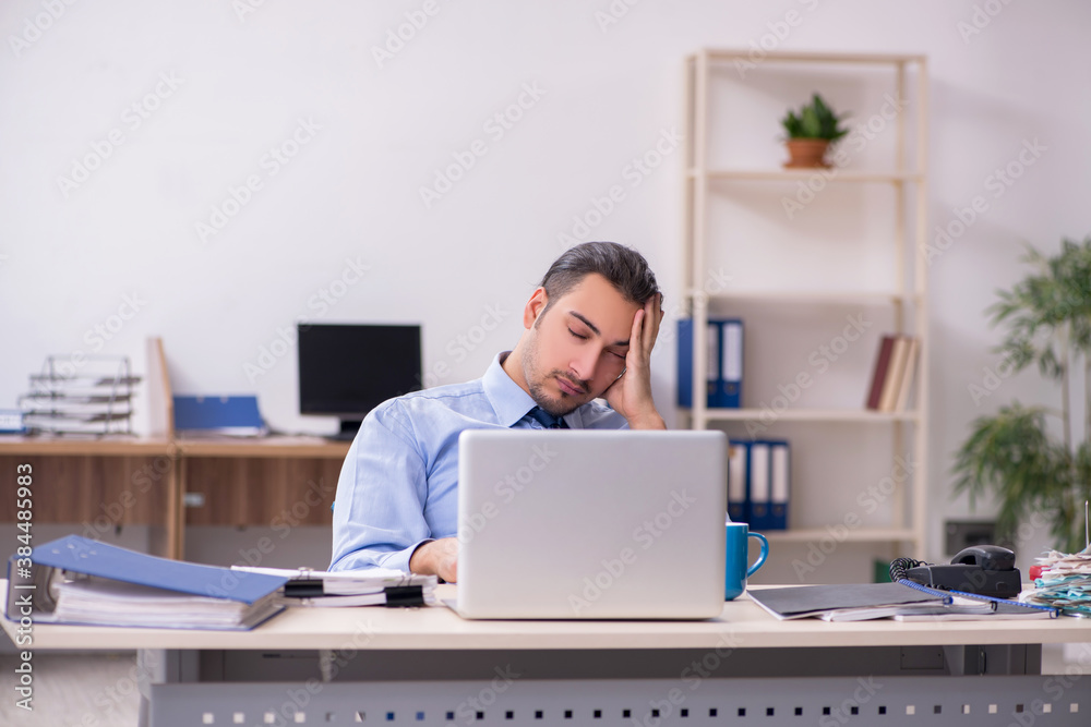 Sick male employee suffering at workplace Sick male employee suffering at workplace