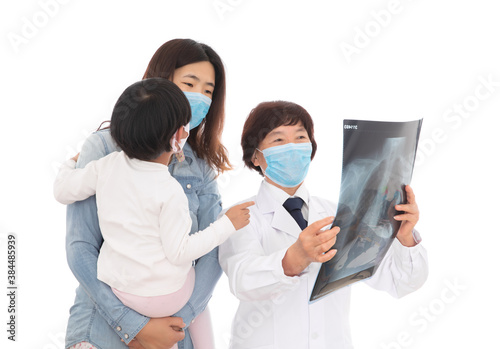 Respiratory doctor is explaining X-rays to parents and children