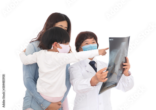 Respiratory doctor is explaining X-rays to parents and children