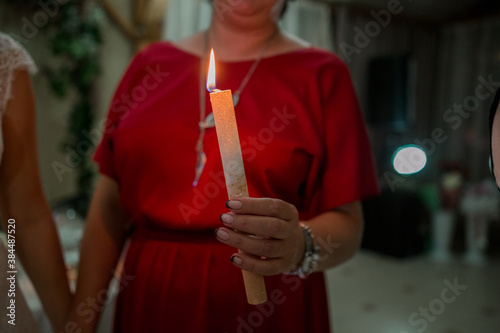 woman with candles in her hands in the twilight