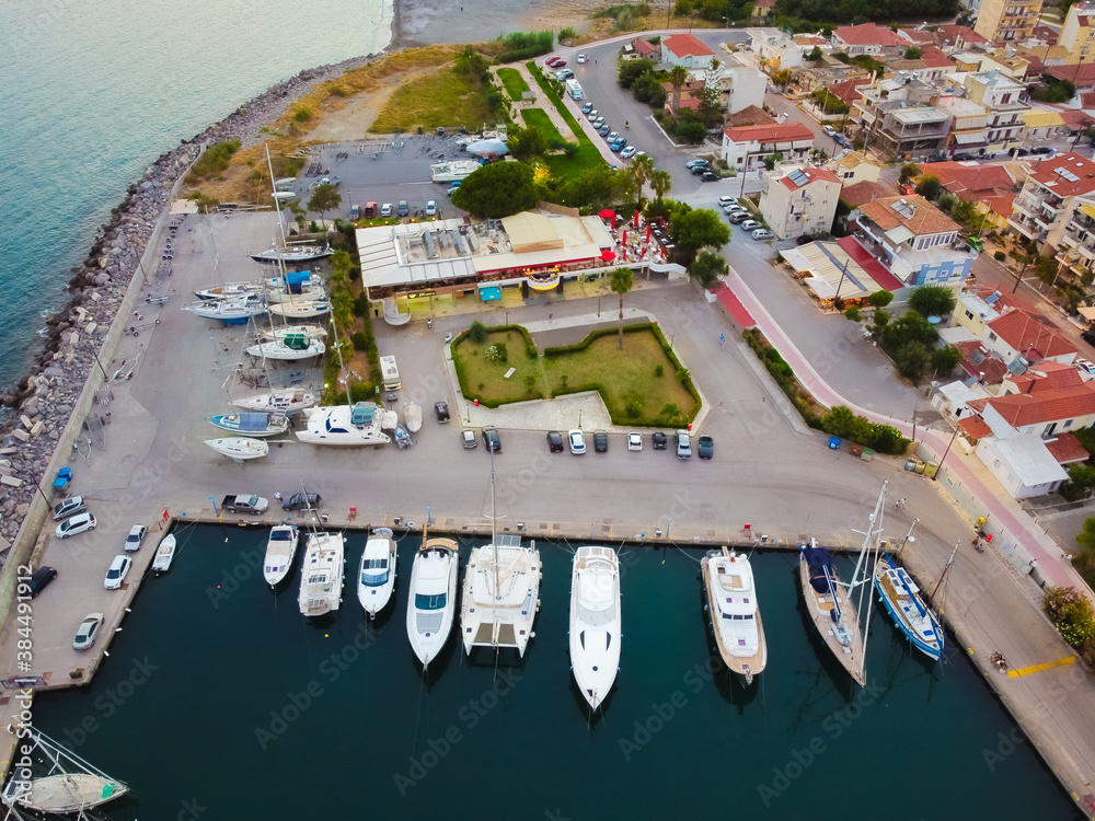 Aerial view of Kalamata marina with luxury yachts in line at dusk