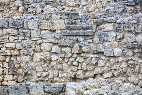 Stones in the wall of the house as an abstract background.