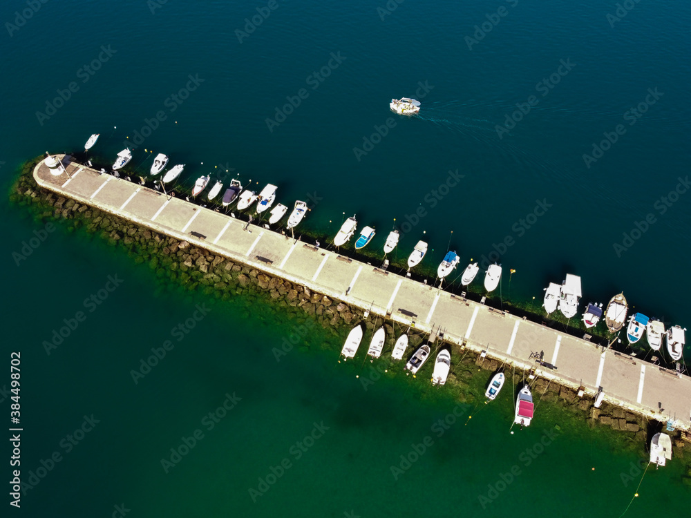 Aerial view of Kalamata marina with fishing boats in line