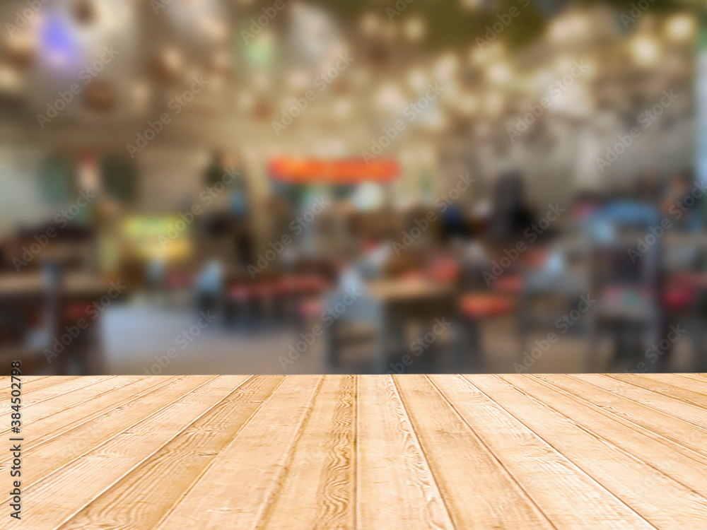 Wooden board with unfocused restaurant background