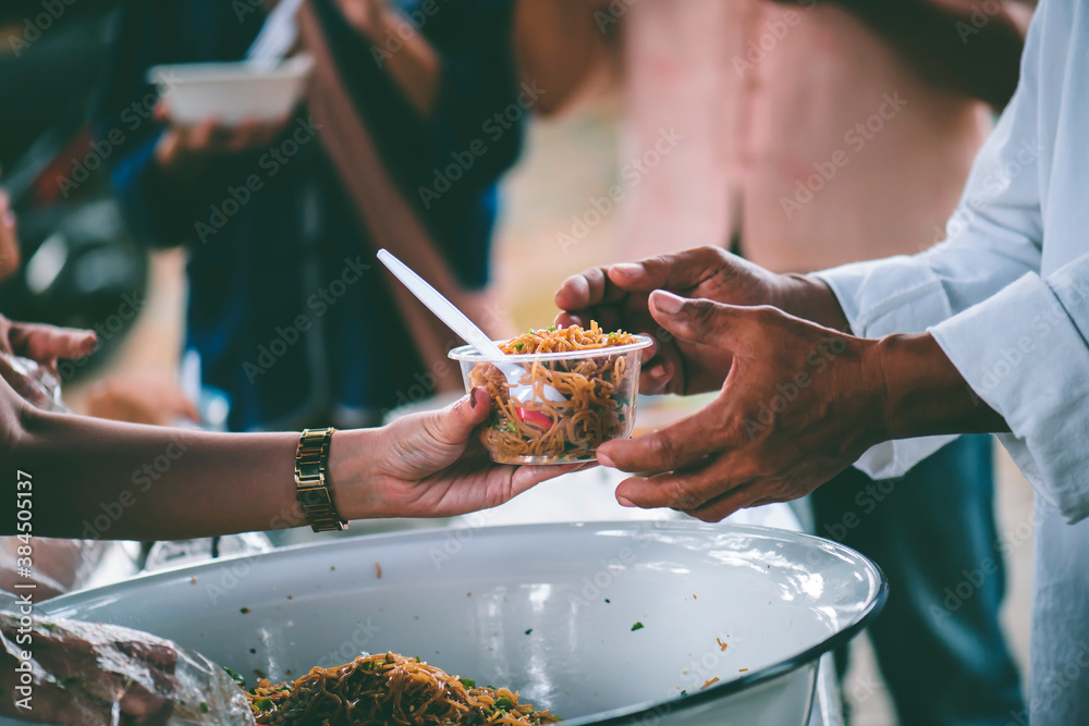 The concept of begging food : Hands of the poor are waiting for food donations to alleviate hunger