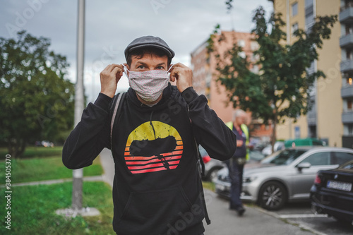 Men wearing face mask in public space. 