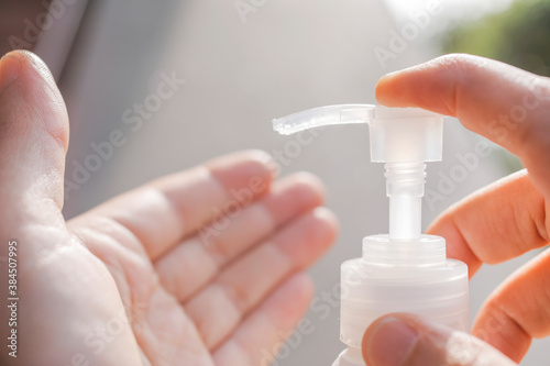 Person cleans his hands  precaution against virus  protection aigainst corona