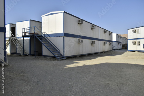 Portacabin, porta cabin, temporary labors camp , Mobile building in industrial site or office container Portable house and office cabins. Labor Camp. Porta cabin. small temporary houses © KG